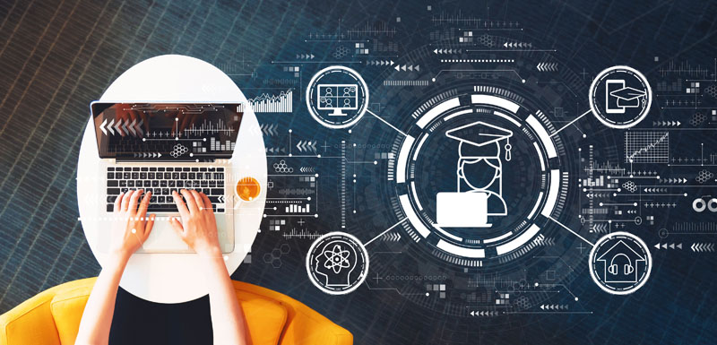 Distance learning theme with person using a laptop on a white table