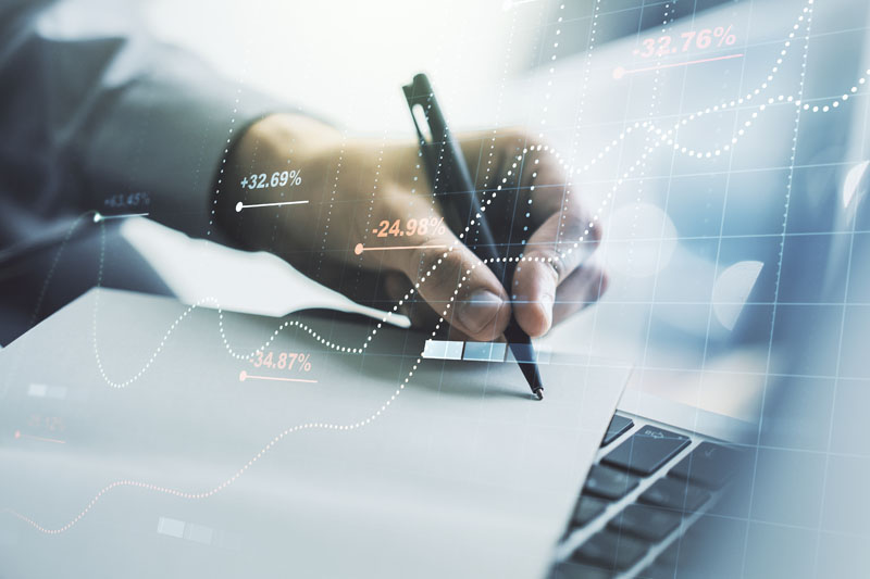 Double exposure of abstract creative statistics data hologram with hand writing in notebook on background with laptop, statistics and analytics concept